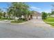 Attractive home featuring a two-car garage, paver driveway, and professionally landscaped front yard at 15531 Waterleigh Cove Dr, Winter Garden, FL 34787