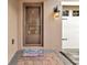 Close-up of the front door showing the welcoming entrance and neat landscaping leading up to the home at 15531 Waterleigh Cove Dr, Winter Garden, FL 34787