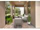 Inviting front porch with comfortable seating and beautiful landscaping at 15531 Waterleigh Cove Dr, Winter Garden, FL 34787