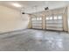 Spacious two car garage with a smooth concrete floor and automatic doors at 15531 Waterleigh Cove Dr, Winter Garden, FL 34787