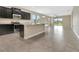 Modern kitchen with granite countertops, stainless steel appliances, and convenient breakfast bar seating at 15531 Waterleigh Cove Dr, Winter Garden, FL 34787