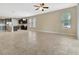 Open-concept area connects the kitchen, dining, and living spaces, offering a seamless flow and ample natural light at 15531 Waterleigh Cove Dr, Winter Garden, FL 34787