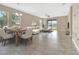 Open-concept living and dining area, filled with natural light, offers versatile space for entertaining guests at 15531 Waterleigh Cove Dr, Winter Garden, FL 34787