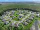 Aerial view of the neighborhood and surrounding natural habitat and water features at 1640 Marsh Pointe Dr, Clermont, FL 34711