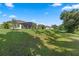 View of the well-maintained backyard landscaping, and exteriors of neighboring properties at 1640 Marsh Pointe Dr, Clermont, FL 34711