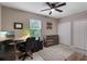 Bedroom with neutral walls, a ceiling fan, and a work-from-home setup at 1640 Marsh Pointe Dr, Clermont, FL 34711