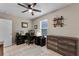 Bedroom with neutral walls, a ceiling fan, and a work-from-home setup at 1640 Marsh Pointe Dr, Clermont, FL 34711