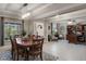 Elegant dining room with stylish light fixture and direct access to living room and home office at 1640 Marsh Pointe Dr, Clermont, FL 34711