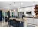 Well-equipped kitchen with stainless steel appliances, granite countertops, and a convenient island with bar stools at 1640 Marsh Pointe Dr, Clermont, FL 34711