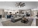 Open-concept living room featuring a comfortable sofa, stylish decor, and seamless flow into the kitchen and dining area at 1640 Marsh Pointe Dr, Clermont, FL 34711