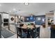 Open-concept living space with modern kitchen, cozy living area, and dining area, great for entertaining at 1640 Marsh Pointe Dr, Clermont, FL 34711