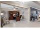 Spacious home office with built-in shelving, a comfortable seating area, and seamless access to the rest of the home at 1640 Marsh Pointe Dr, Clermont, FL 34711