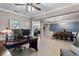 Functional home office with modern desk setup and seamless access to the dining room, living room and kitchen at 1640 Marsh Pointe Dr, Clermont, FL 34711
