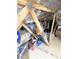 Attic with wooden beams and organized storage solutions at 1676 Van Buren Way, The Villages, FL 32162