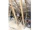 Spacious attic with exposed beams and ample storage space at 1676 Van Buren Way, The Villages, FL 32162