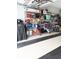 Well-organized garage with shelving and storage solutions for tools and equipment at 1676 Van Buren Way, The Villages, FL 32162