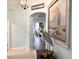 Decorated home entrance hall with ocean themed decor at 1676 Van Buren Way, The Villages, FL 32162