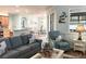 Inviting living room with comfortable seating and ocean themed decor at 1676 Van Buren Way, The Villages, FL 32162