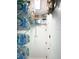 Walk-in storage room with ample shelving for household goods and supplies at 1676 Van Buren Way, The Villages, FL 32162