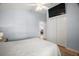 Cozy bedroom features a TV mounted on the wall and an ensuite bath at 16827 Se 92Nd Lance Ct, The Villages, FL 32162