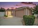 Charming single-story home with a two-car garage, lush landscaping, and a screened-in porch at 16827 Se 92Nd Lance Ct, The Villages, FL 32162