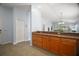 Kitchen cabinets with a breakfast bar overlooking the living room at 16827 Se 92Nd Lance Ct, The Villages, FL 32162