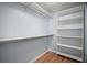 Spacious walk-in closet with built-in shelving and ample storage space at 16827 Se 92Nd Lance Ct, The Villages, FL 32162