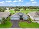 Gorgeous aerial view of home near golf course and other residences at 1706 Augustine Dr, The Villages, FL 32159