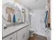 Bright bathroom with a large mirror over a single sink and walk-in shower at 1706 Augustine Dr, The Villages, FL 32159