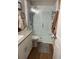 Modern bathroom featuring a frameless glass shower, and bright vanity with countertop at 1706 Augustine Dr, The Villages, FL 32159