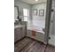Bright bathroom featuring a soaking tub, and a separate walk-in shower at 1706 Augustine Dr, The Villages, FL 32159
