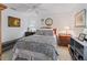 Neutral bedroom featuring a ceiling fan, night stands, and neutral carpeting at 1706 Augustine Dr, The Villages, FL 32159