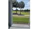 Scenic view of the lush golf course from the covered patio, perfect for relaxing and enjoying the outdoors at 1706 Augustine Dr, The Villages, FL 32159