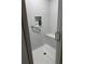 Accessible walk-in shower featuring a built-in seat and grab bar at 1706 Augustine Dr, The Villages, FL 32159