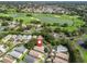 Scenic aerial view of a home near a golf course and lake in a vibrant community at 17324 Se 82Nd Pecan Ter, The Villages, FL 32162
