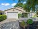Charming home with well-maintained landscaping and a stone paver driveway at 17324 Se 82Nd Pecan Ter, The Villages, FL 32162