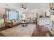 Open-concept living room and dining area with hardwood floors and stylish coastal décor at 17324 Se 82Nd Pecan Ter, The Villages, FL 32162