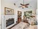 Inviting living room with fireplace and cozy seating, offering a relaxing atmosphere at 17324 Se 82Nd Pecan Ter, The Villages, FL 32162