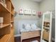 Walk-in closet with a vanity area, shelving, mirror and hardwood floors at 17324 Se 82Nd Pecan Ter, The Villages, FL 32162