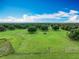 Beautiful aerial view of land parcel showing its pastures, fencing and mature trees at 17670 Se 283Rd Ave, Umatilla, FL 32784
