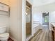 Bathroom featuring a glass-enclosed shower and separate tub, complemented by vanity and fixtures at 17670 Se 283Rd Ave, Umatilla, FL 32784