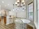 Kitchen and breakfast nook area with views into the living room, combining modern and traditional elements at 17670 Se 283Rd Ave, Umatilla, FL 32784