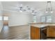 Open-concept living space featuring hardwood floors, recessed lighting, and a breakfast bar for casual dining at 17670 Se 283Rd Ave, Umatilla, FL 32784