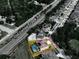 Aerial view outlines a property with pool, solar panels and fenced yard bordered by Old Canoe Creek Rd at 1861 Remembrance Ave, St Cloud, FL 34769