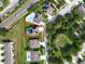 Aerial view showcases a property with a screened pool and a fenced yard, marked by a red line at 1861 Remembrance Ave, St Cloud, FL 34769