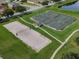 Aerial view of the community sand volleyball and basketball courts at 1861 Remembrance Ave, St Cloud, FL 34769