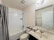 Clean bathroom with white tiles, vanity, and modern fixtures at 1861 Remembrance Ave, St Cloud, FL 34769