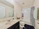 Bathroom with tiled shower-tub combo, marble sink top and classic fixtures at 1861 Remembrance Ave, St Cloud, FL 34769