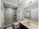 Updated bathroom with gray tile shower, modern vanity, and stylish fixtures at 1861 Remembrance Ave, St Cloud, FL 34769