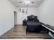 Bedroom features wood-look flooring, ceiling fan and minimalist decor at 1861 Remembrance Ave, St Cloud, FL 34769